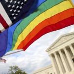 An American flag and a rainbow colored flag flies in front of the Supreme Court in Washington, Monday, April 27, 2015, as the Supreme Court is scheduled to hear arguments on the constitutionality of state bans on same-sex marriage on Tuesday. (AP Photo/Andrew Harnik)