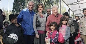 Elder M. Russell Ballard, Elder Patrick Kearon, and Sister Jennifer Kearon visit refugees on the Greek island of Lesbos. 